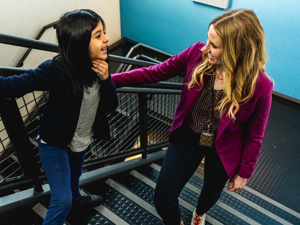 Joanna Lago with a student at Sherlock school in Cicero